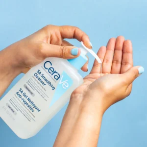 cerave-sa-smoothing-cleanser-in-use-lifestyle-hand-pump-pakistan CeraVe SA Smoothing Cleanser being dispensed into hand for use on rough and bumpy skin in Pakistan