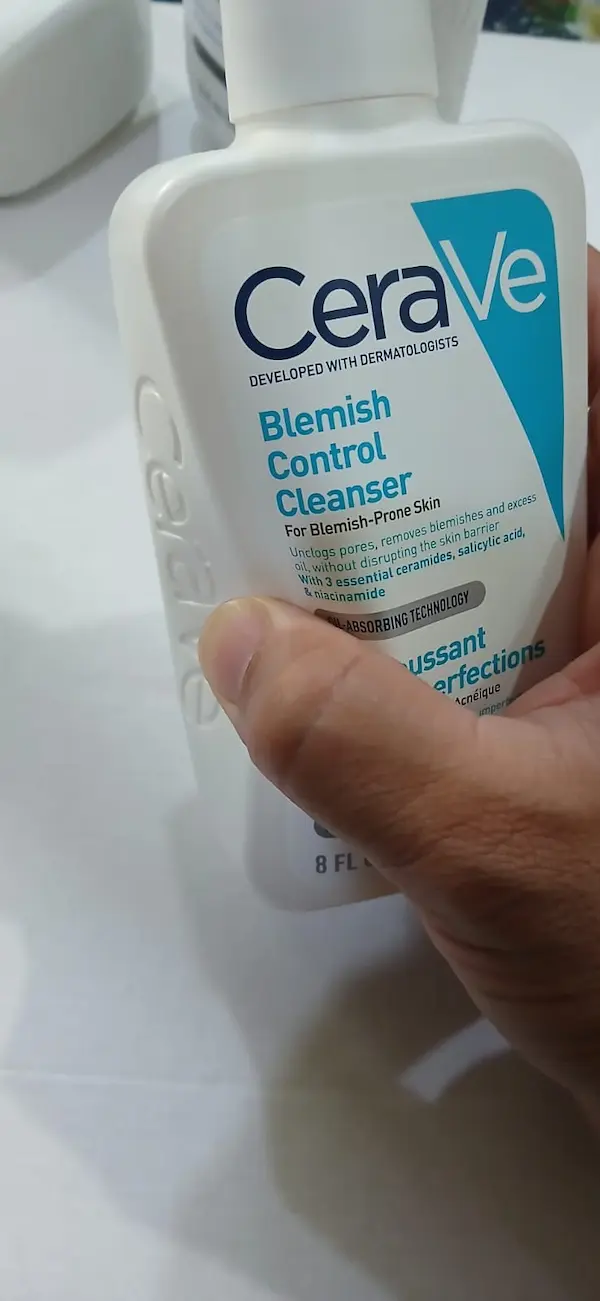 Original CeraVe Blemish Control Cleanser pressing in easily, showing the soft bottle of a genuine product