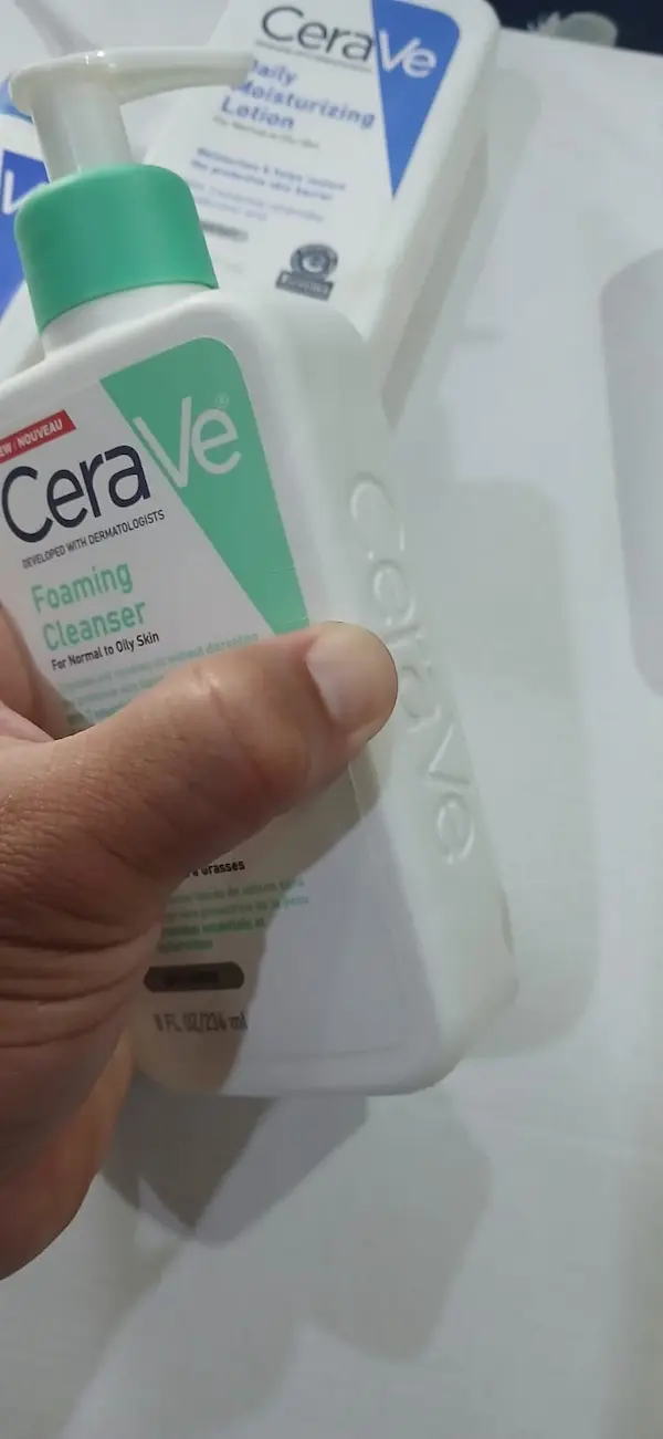 Fake CeraVe Foaming Facial Cleanser being pressed, the hard bottle does not press in