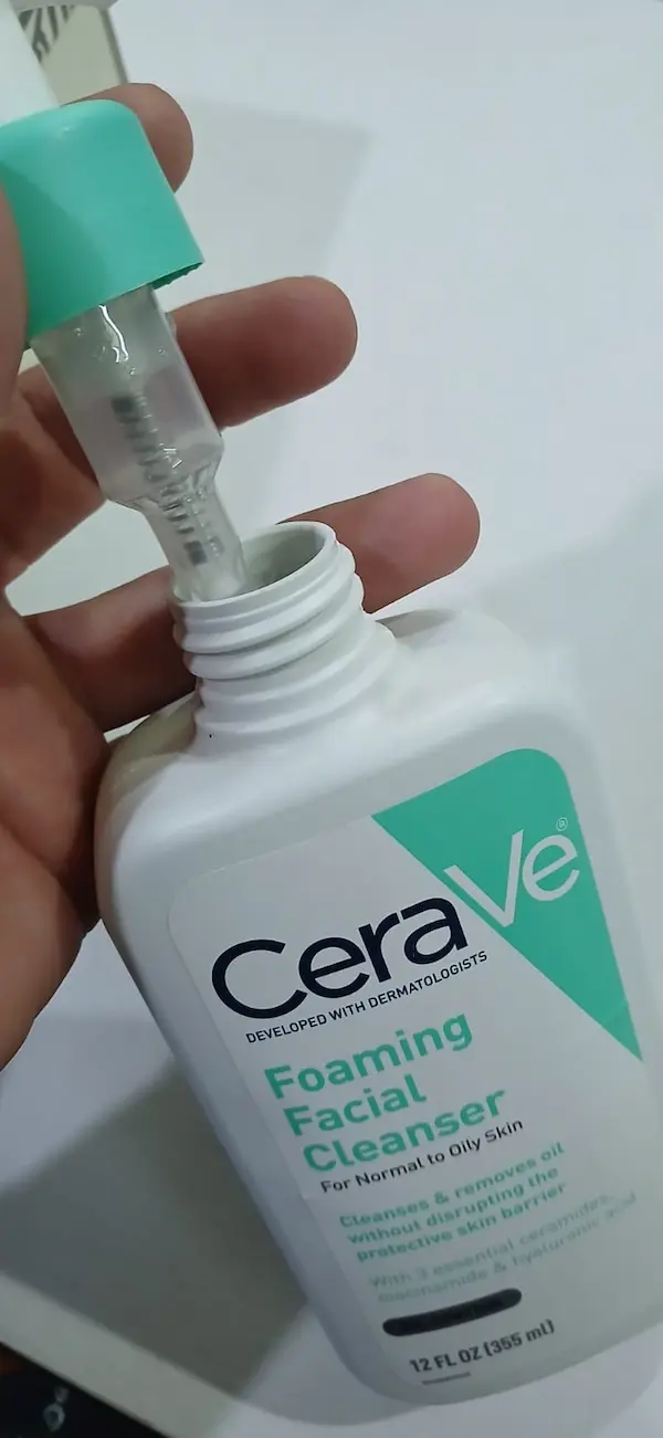Original CeraVe cleanser pump pulled out, showing the clear spring inside a genuine bottle