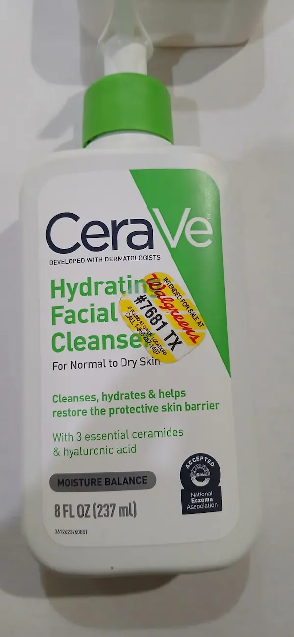 Original CeraVe Hydrating Facial Cleanser with a Walgreens store sticker, showing this is normal on genuine bottles