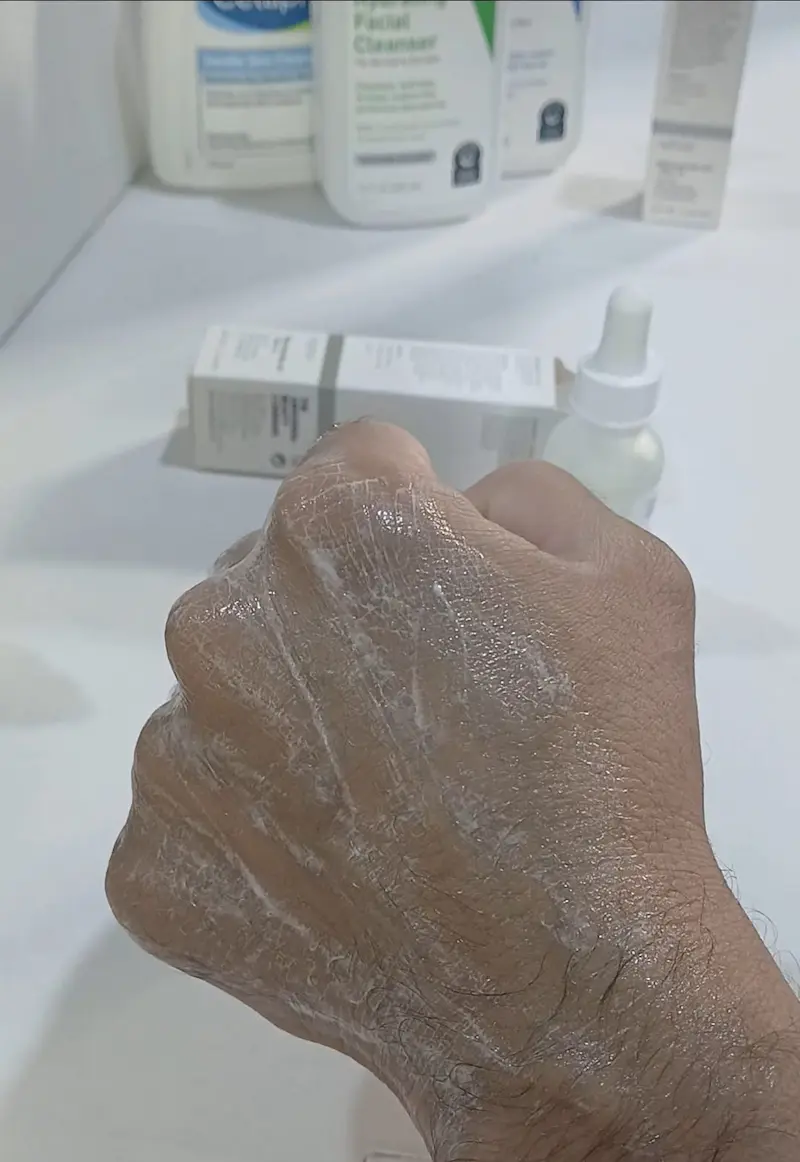 White foam from original The Ordinary Niacinamide serum visible on the skin before absorbing